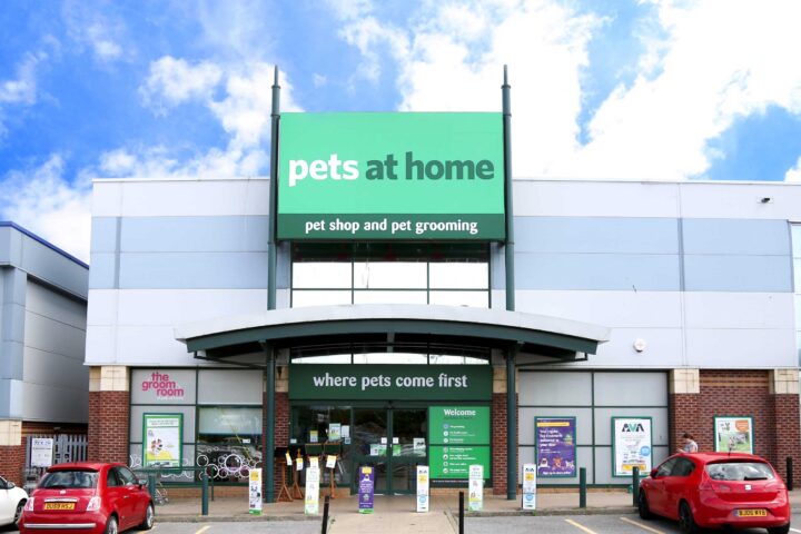 Pet store exterior with pet grooming services and signage